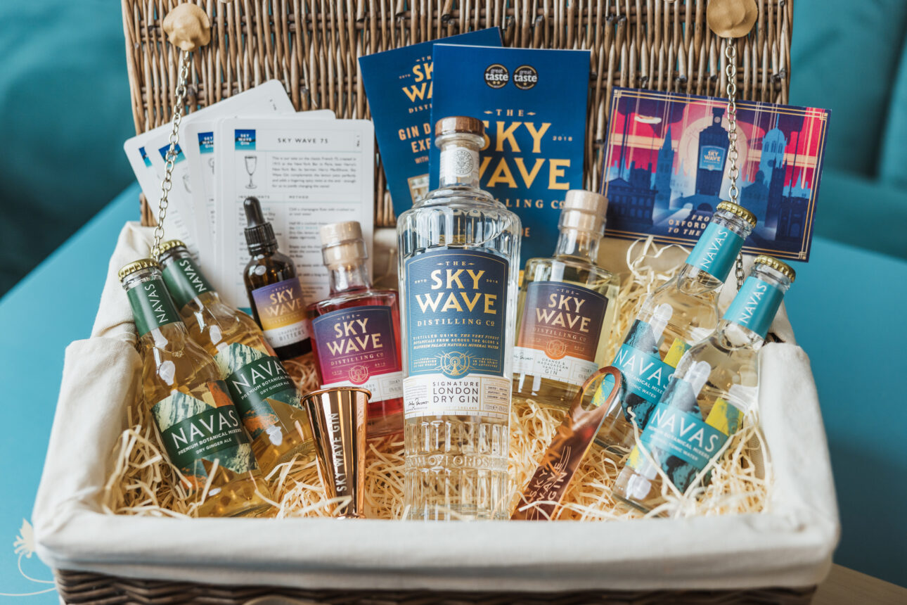 A hamper full of gin and associated products.